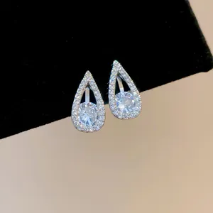 Close-up of elegant water-drop clip-on earrings with shimmering cubic zirconia