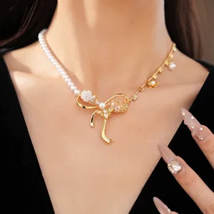 Elegant asymmetric pearl and gold necklace with zircon bee floral bow pendant for women