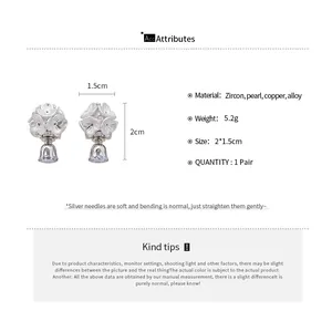 Detailed view of floral pearl earrings with dimensions and material specifications