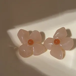 Detailed close-up of Thai tea jelly acrylic flower earrings with retro French design