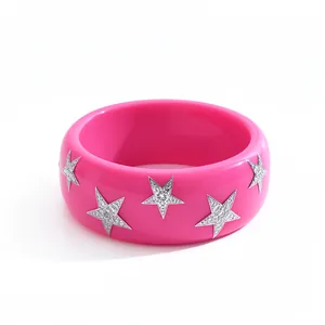 Vibrant hot pink resin bangle bracelet featuring sparkling silver crystal star charms.