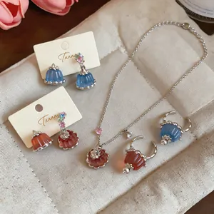 Close-up of exquisite resin pudding jewelry set including zircon necklace and earrings