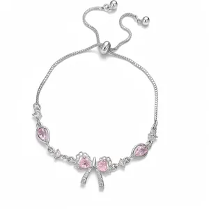 Bracciale regolabile color argento con fiocco in zircone rosa a cuore e goccia