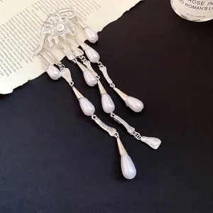 Exquisite vintage eye-shaped silver brooch with cascading white pearl waterdrop tassels