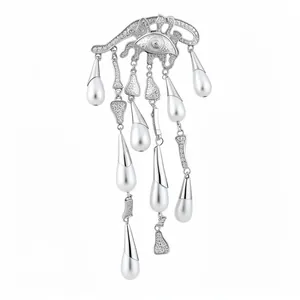 Elegant silver eye brooch featuring crystal accents and dangling white pearl tassels