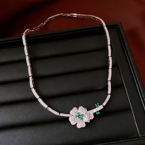 Exquisite flower necklace featuring green and clear zirconia stones on luxury tray