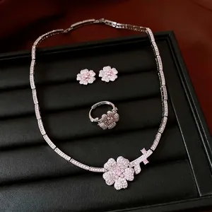 Exquisite zircon flower jewelry set including necklace, earrings, and ring in silver finish
