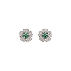 Sparkling silver flower stud earrings with green zircon centers and clear crystals