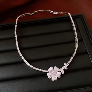 Detailed view of luxury zircon flower necklace with pink and clear stones
