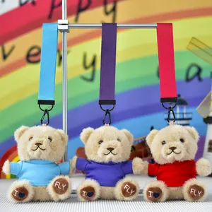 Set of three cute teddy bear plush keychains with colorful shirts and matching straps.