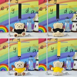 Plush teddy bear keychain pendants in black and yellow outfits with I Love Fly embroidery