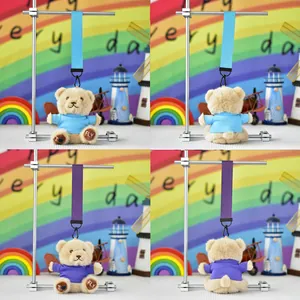 Detailed view of plush teddy bear keychains in blue and purple with custom print.