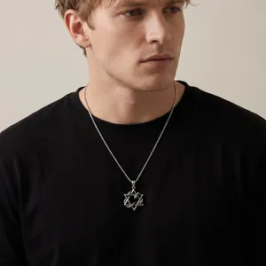Men's stainless steel hexagram necklace with snake pendant on a black t-shirt detail view