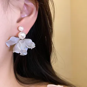 Elegant pearl flower petal drop earrings shown on model for a sophisticated look.
