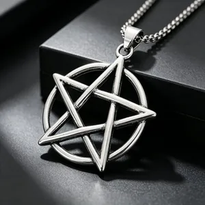 Detail of a vintage stainless steel pentagram pendant with durable metal chain.