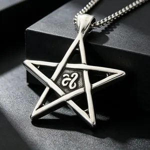 Macro view of a stainless steel pentagram pendant with a central engraved symbol