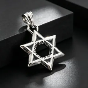 Macro view of a stainless steel hexagram star pendant with gothic style engravings