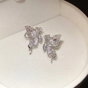 Exquisite zircon butterfly wing ear cuffs with sparkling crystals in a white jewelry box