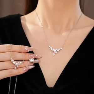 Elegant silver clavicle chain necklace with white pearls and sparkling water-drop zircons.
