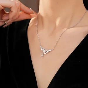 Elegant silver-tone chain necklace with white pearls and teardrop zircon pendant
