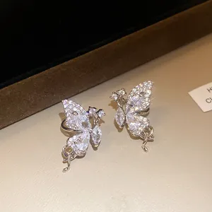 Detail showing the sparkling zircon-encrusted butterfly wing ear cuff design.