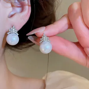 Elegant pearl stud earrings with sparkling zircon geometric details for a sweet look