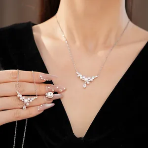 Elegant silver-tone clavicle necklace with white pearls and sparkling teardrop zircon details