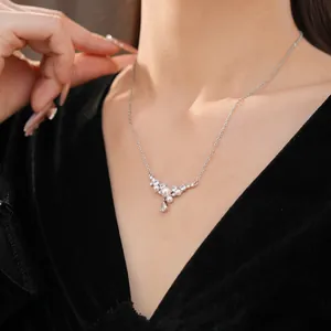 Macro detail of elegant silver necklace with pearls and zircon water drop pendant