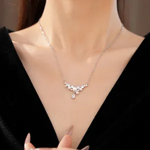 Elegant zircon and water drop pearl necklace close-up on model with black velvet