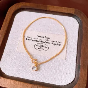 Elegant 18k gold plated snake chain bracelet featuring a sparkling round zircon pendant