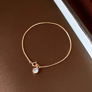 Elegant 18k gold plated snake chain bracelet featuring a sparkling round zircon pendant