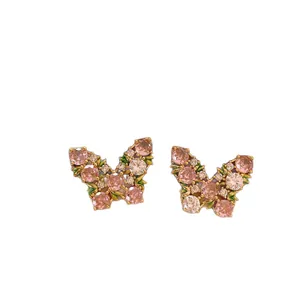 Elegant pink zircon butterfly stud earrings with silver needles and luxury gold finish