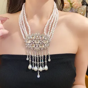 Elegant multi-strand pearl necklace featuring rhinestone centerpiece and waterdrop tassels