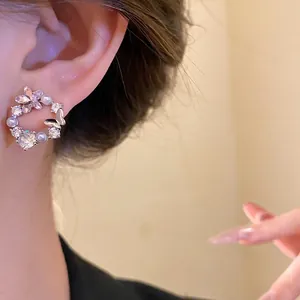 Elegant 18k gold plated circular wreath earrings with butterfly, zircons and pearls