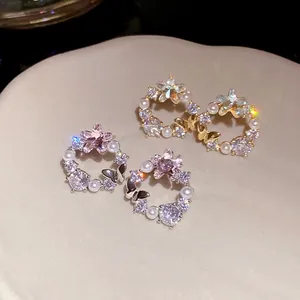 Elegant 18K gold and silver plated butterfly stud earrings with zircons and pearls