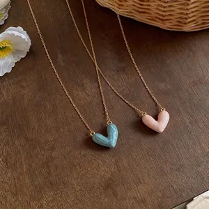Elegant 14k gold plated clavicle chain necklace with marbled enamel heart pendant