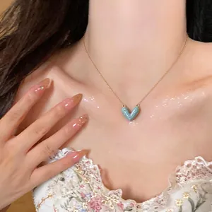 Elegant 14k gold-plated heart necklace with light blue enamel pendant for women