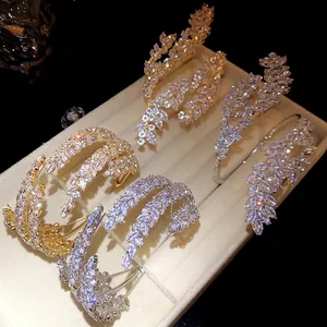 Elegant triple-layer leaf crossover open bangle with sparkling zircons in two colors.