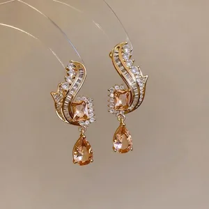 Elegant vintage gold-plated earrings with champagne zircon square and teardrop pendants.