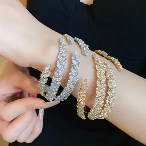 Professional detail view of sparkling zircon three-layer leaf vintage style open bangle on wrist