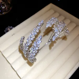 Close-up of elegant silver bracelet with sparkling marquise-cut leaf pattern