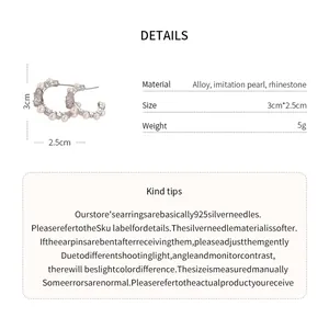 Detailed view of C-shaped pearl earrings with rhinestone accents and alloy material
