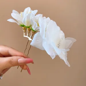 Elegant white fabric flower hair fork for women with gold metal U-pin design detail