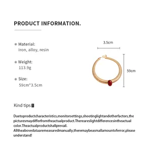 Detailed product specifications of a vintage gold metal choker with red resin stone