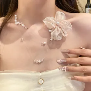 Close-up detail view of a beaded chiffon flower necklace featuring elegant pearl accents