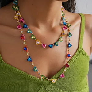 Detailed view of dopamine style heart necklace with colorful enamel and rhinestones