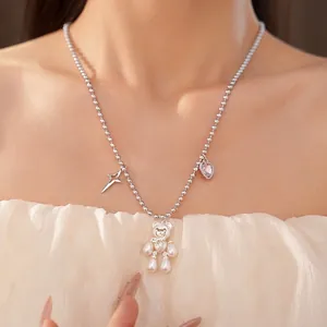 Elegant bear pearl necklace featuring zircon star and pink heart charms on a bead chain