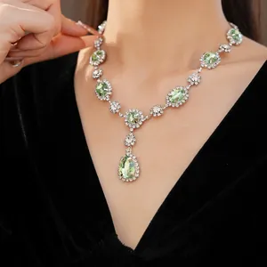 Elegant luxury court style necklace with green teardrop crystals and sparkling white diamonds