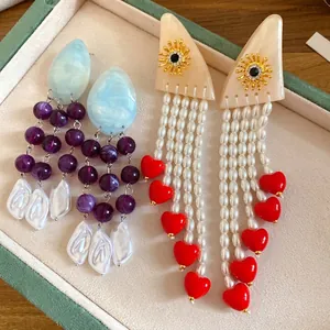 Handmade vintage ethnic resin pearl tassel earrings with sun motifs and red heart charms