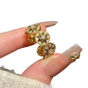 14k gold plated starburst ring with zircons, elegant circular star design for women